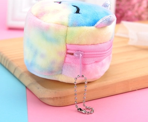 Detailed view of colorful plush mini coin purse with unicorn embroidery and pink zipper