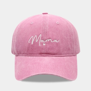 Macro detail of white Mama embroidery and heart on washed pink cotton baseball cap