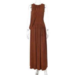 Detail of high-waist brown sleeveless dress featuring ruched neckline and pearlescent fabric