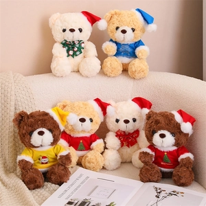 Detailed view of six Christmas teddy bears in various colors on a beige sofa