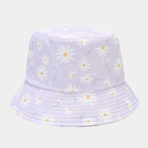 Close-up of small white daisy pattern and precision stitching on light purple sun hat