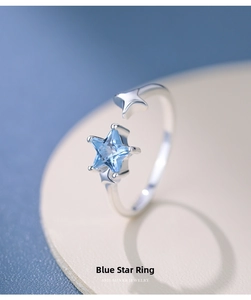 Macro detail of S925 silver ring featuring blue star zircon and asymmetric adjustable band