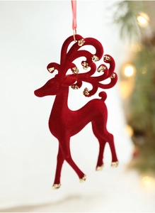 Close-up of red flocked reindeer Christmas ornament with elegant gold glitter accents