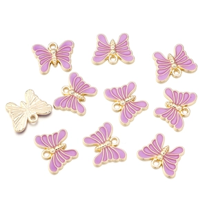 Detailed view of ten pink enamel butterfly charms with gold alloy bases for DIY jewelry