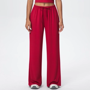 Detail of high-waist dark red wide-leg lounge pants with elastic drawstring waistband