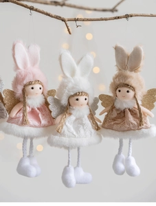 Detailed view of plush angel girl dolls with lace skirts and wings for Christmas tree decor