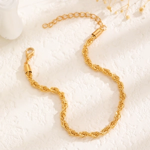Elegant gold twisted rope chain bracelet for women featuring an adjustable lobster clasp