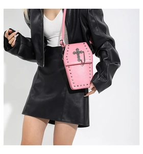 Pink coffin-shaped gothic crossbody bag with metallic studs and hanging chain detail