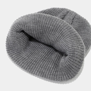 Deep grey knitted beanie with classic vertical stripe texture and thick rolled cuff style