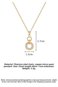 Macro shot of interlocking double ring pendant necklace with paved zircons in gold finish