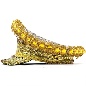 Detailed side view of golden military party hat with sequins and yellow gemstone accents