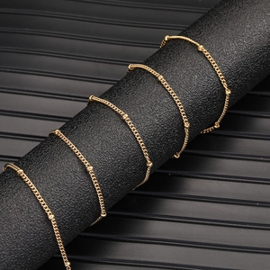 Detailed view of 18K gold plated stainless steel satellite chain with small beads