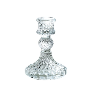 Elegant French vintage crystal glass candle holder with diamond cut texture on white background