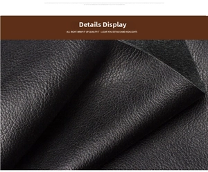 Close-up detail of premium black pebble grain leather texture on long wallet
