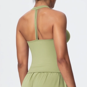 Close-up of seamless racerback design and brushed fabric texture on light green sports bra