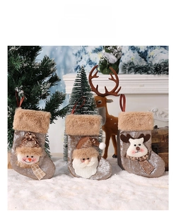 Detailed view of Christmas stockings with Santa, Snowman and Reindeer 3D sequin design