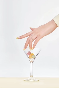 Close-up of stacked S925 sterling silver rings with colorful zircon pavé on a hand
