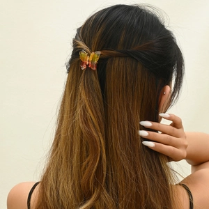 3.5cm transparent butterfly hair clip with yellow-orange gradient on model hair