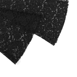 Close-up of intricate black rose floral lace texture with delicate hollowed-out patterns