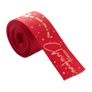 Red grosgrain Christmas ribbon with gold Merry Christmas lettering for gift wrapping