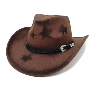 Close-up of brown wool western cowboy hat with star patterns and silver buckle