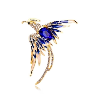 Elegant phoenix brooch with gold plating, blue enamel wings and sparkling rhinestones