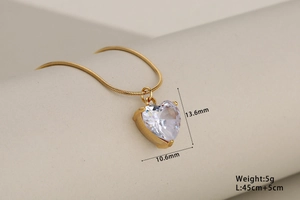 Detail view of heart crystal pendant with size specs and gold snake chain