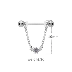 Macro shot of silver nipple ring with three stars and zircon pendant, 19mm height