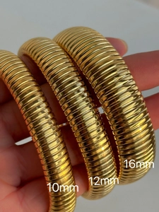 Detailed macro view showing three widths 10mm 12mm and 16mm of polished 18k gold plated bangles
