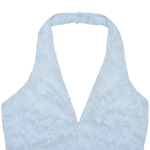Detail of light blue backless halter neck top with textured jacquard fabric and V-neckline