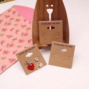 Golden heart and flower dangle earrings on S925 sterling silver cards with a wooden bear