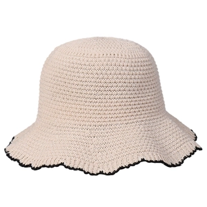 Elegant wavy edge knit sun hat for women with black trim on a cream white dome fisherman cap