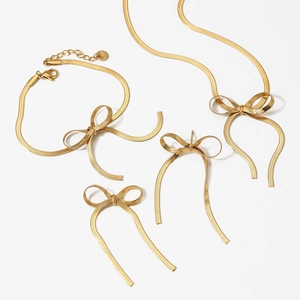 Elegant gold stainless steel jewelry set featuring bow-knot necklace bracelet and earrings