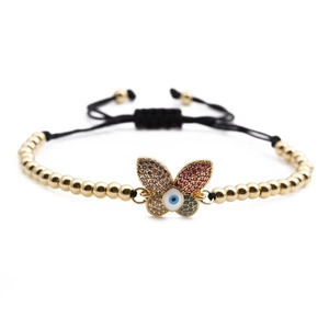 Adjustable gold bead bracelet featuring a butterfly with colorful zircon and evil eye charm