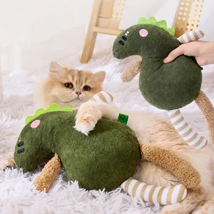 Green dinosaur plush cat toy with crinkle paper and squeaker for interactive pet play