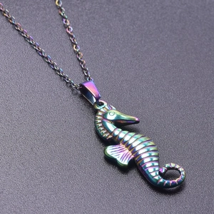 Detailed close-up of rainbow PVD coated seahorse pendant on a matching metal chain