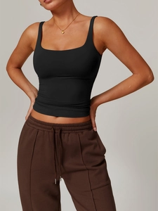 Detail of slim-fit Y2K black ribbed tank top with cropped design for women