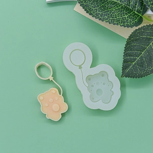Balloon bear silicone mold for DIY baking and fondant with finished orange bear sample