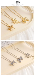 Macro display of copper bow pendants with micro-set cubic zirconia in gold and silver