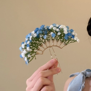Elegant gold flower hair pin featuring blue and white gypsophila for wedding hairstyles