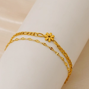 18K gold plated double layer Figaro chain bracelet featuring a delicate daisy flower charm