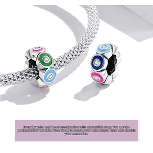 Macro shot of S925 sterling silver evil eye charm with colorful enamel and zircon stones