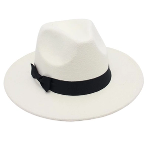 Detailed view of the white wool felt fedora featuring a classic black grosgrain bow band