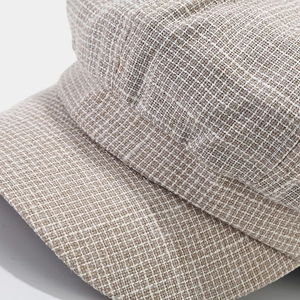 Close-up of the breathable woven texture on this vintage beige linen newsboy cap