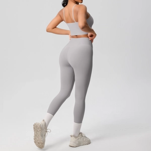 Detail of high-waist grey yoga set featuring seamless fabric and back line design