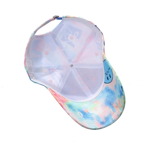 Detail of colorful tie-dye baseball cap interior with 100% cotton label and metal buckle