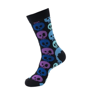 Close-up of black cotton socks with colorful pixel skull patterns and ribbed elastic cuffs