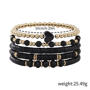 Detail view of 5-piece black and gold bohemian bracelet set with size and weight specs