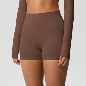 Detail of high-waisted dark brown yoga shorts featuring supportive and seamless fabric