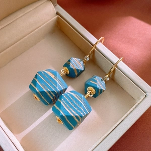 Vintage geometric blue-green bead earrings with golden stripes and metal hooks